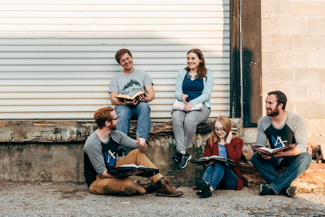 group of friends discussing book